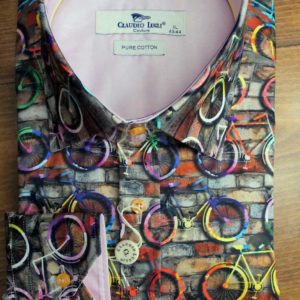 Claudio Lugli shirt with bicycles painted on a wall with pink lining