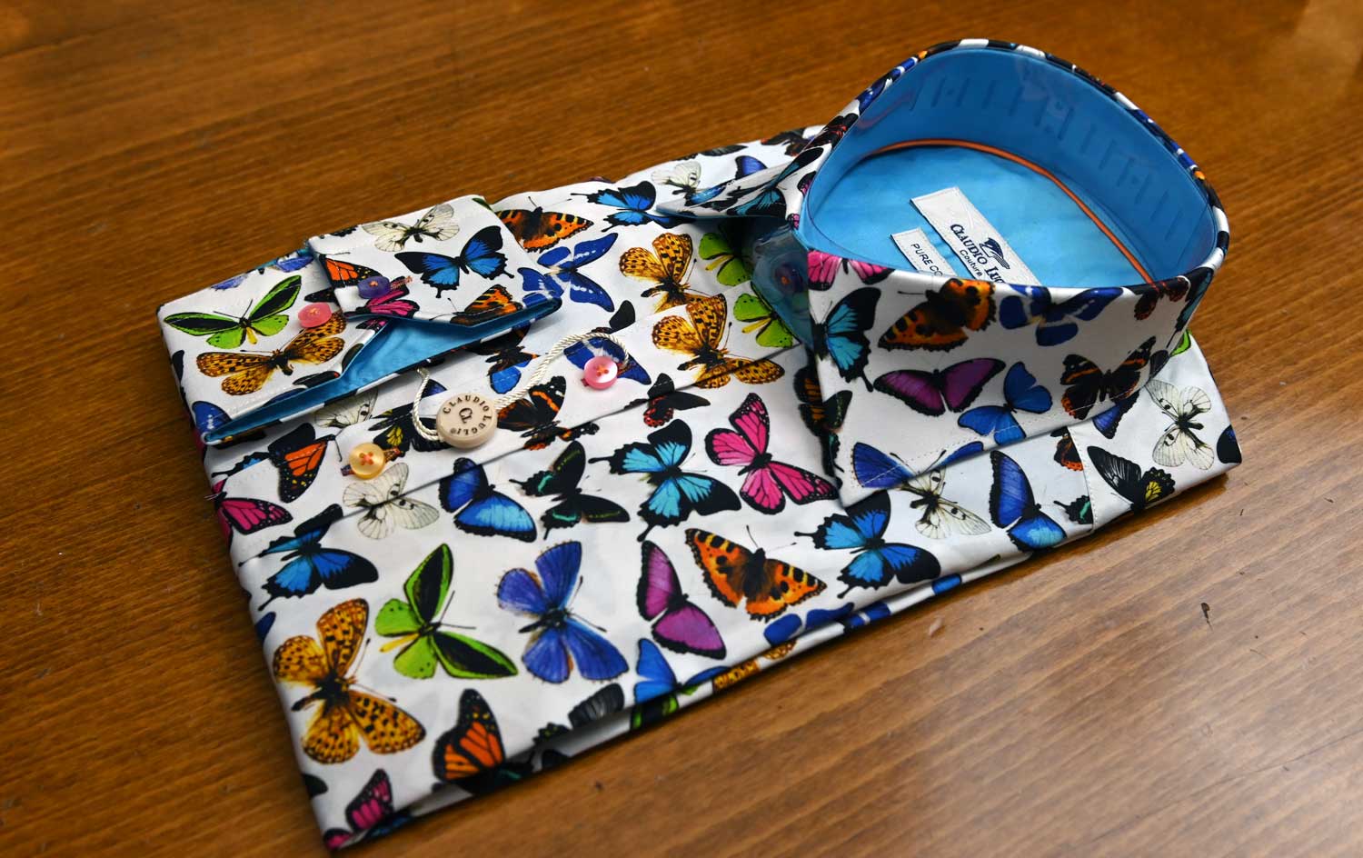 Claudio Lugli shirt with colourful butterflies on white, blue lining.