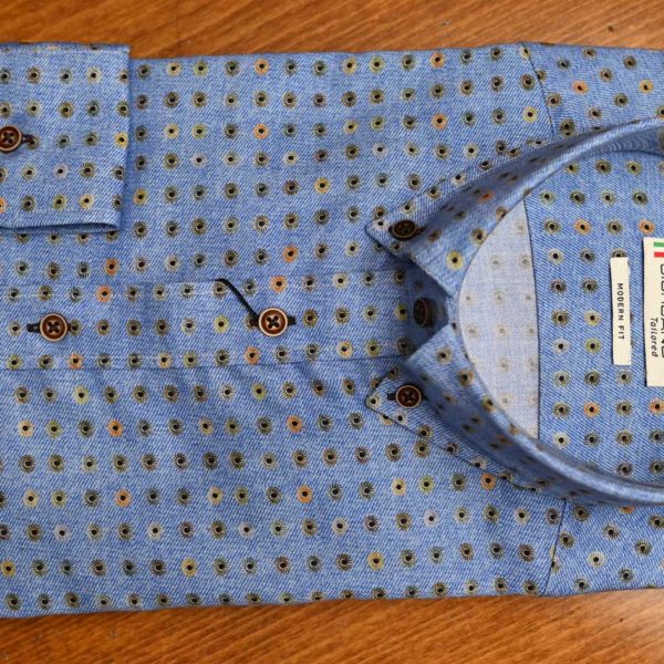 Giordano shirt with small yellow, green and brown flowers on pale blue cotton