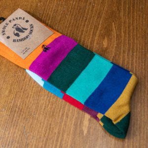 Swole Panda bamboo sock with green, blue, yellow and pink stripes