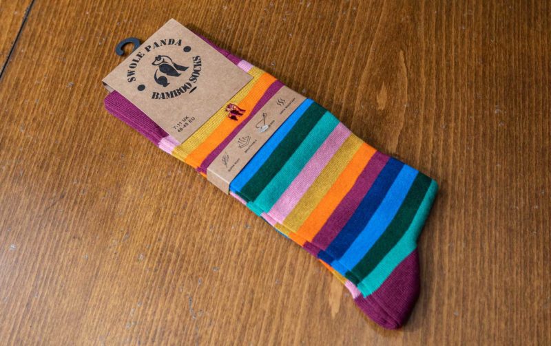 Swole Panda bamboo sock with pink, blue and yellow stripes
