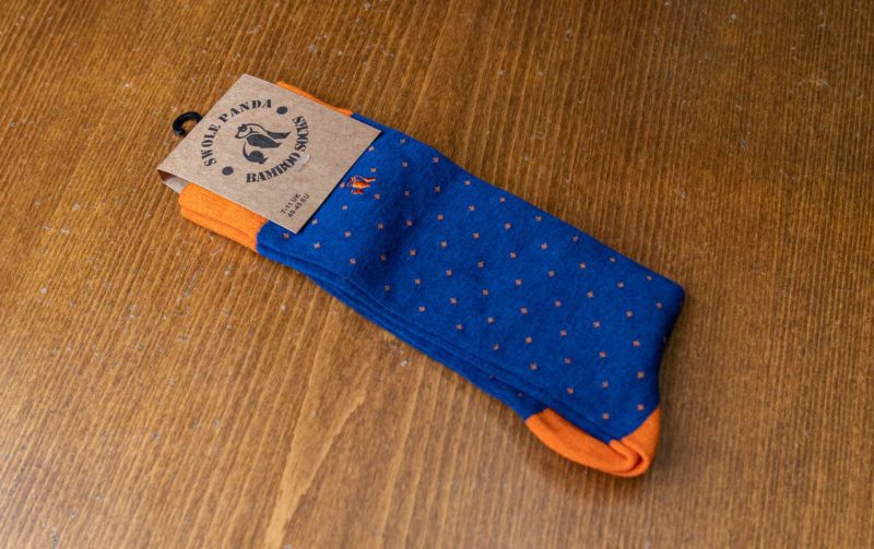 Swole Panda bamboo sock in blue with orange spots