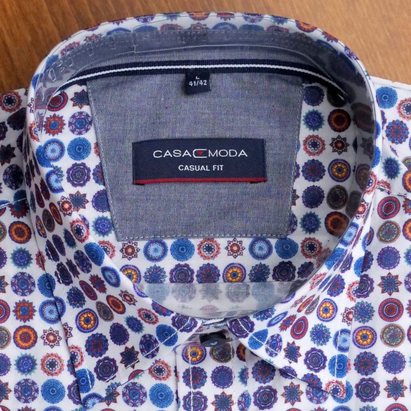 Casa Moda short sleeved shirt with blue, orange and red circles and stars on white