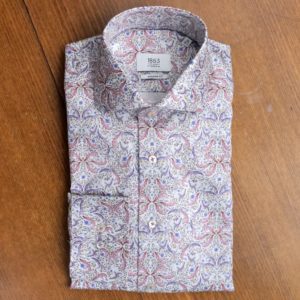 Eterna shirt with red leaves and blue foliage on white.