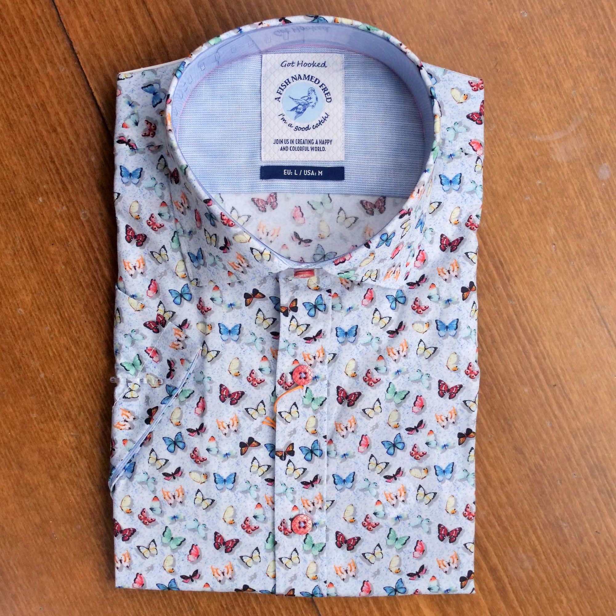 A Fish Named Fred shirt with small butterflies on pale blue cotton. From Gabucci Menswear Bath