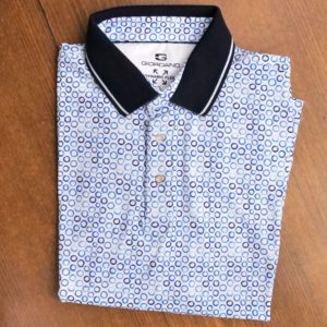 Giordano short sleeved polo shirt with blue circles on white with a black collar