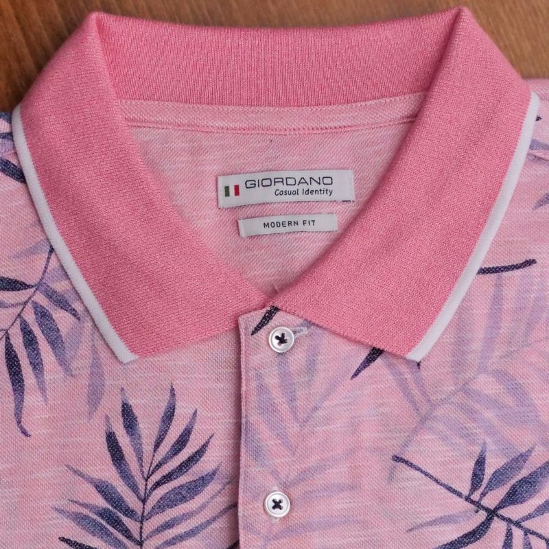 Giordano short sleeved polo shirt with dark leaves on pink with a pink collar