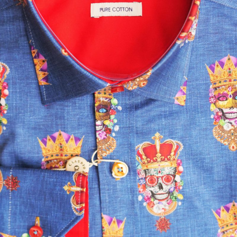 Claudio Lugli shirt in denim blue with skulls in crowns wearing jewellery and masks with a red lining
