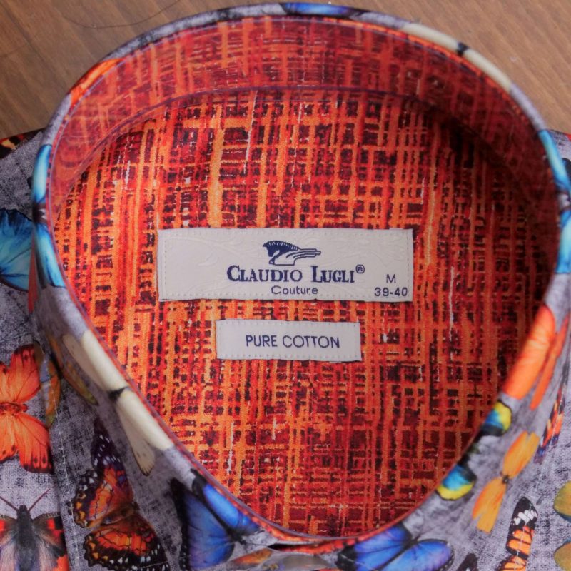 Claudio Lugli shirt with colourful exotic butterflies on grey with a patterned orange lining from Gabucci Menswear Bath.