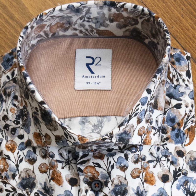R2 shirt with winter foliage with orange, brown and blue colours on a white background