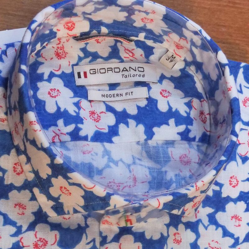 Giordano blue shirt with white flower design with red stamens