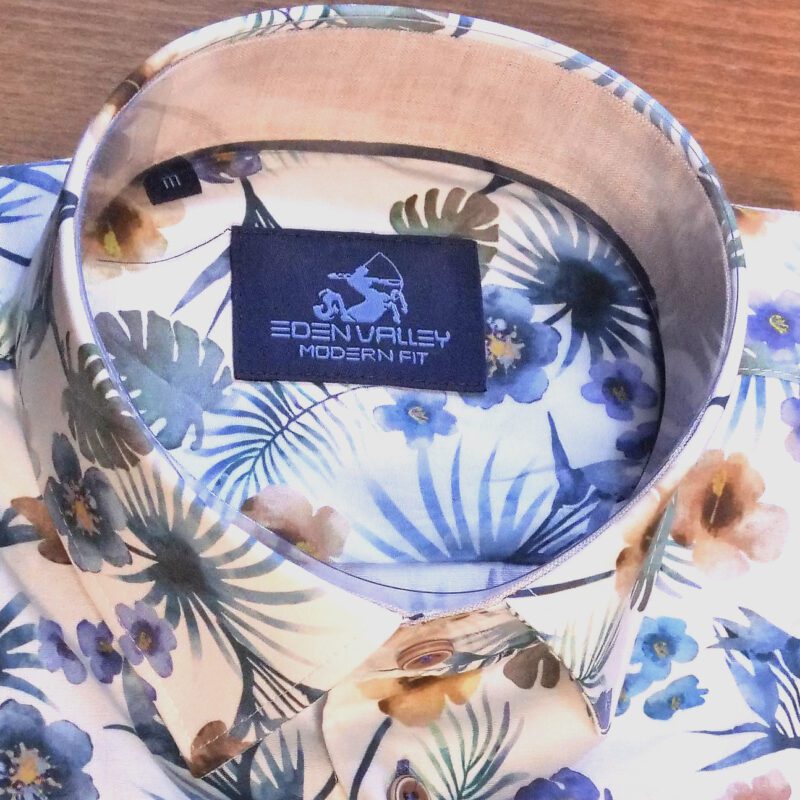 Eden Valley white shirt with large muted flowers on blue and green foliage with soft pink inner collar and cuffs
