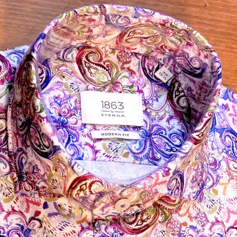 Eterna white shirt with large stylised purple green and red foliage