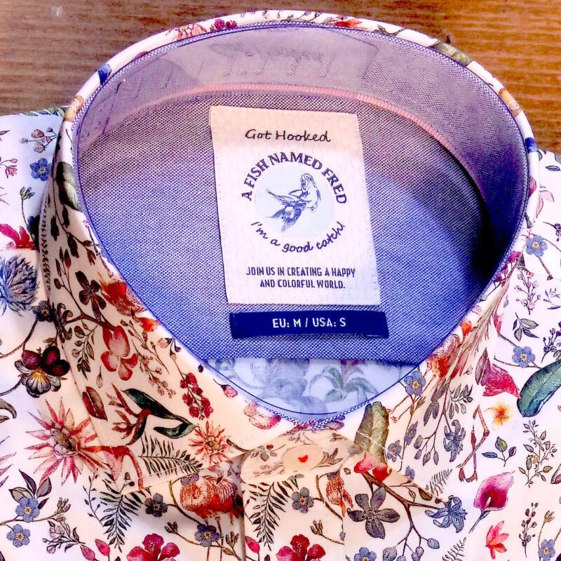 A Fish Named Fred white shirt with coral flamingos and brightly coloured foliage, blue lining