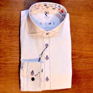 R2 white shirt with blue buttons and red and blue stitching details