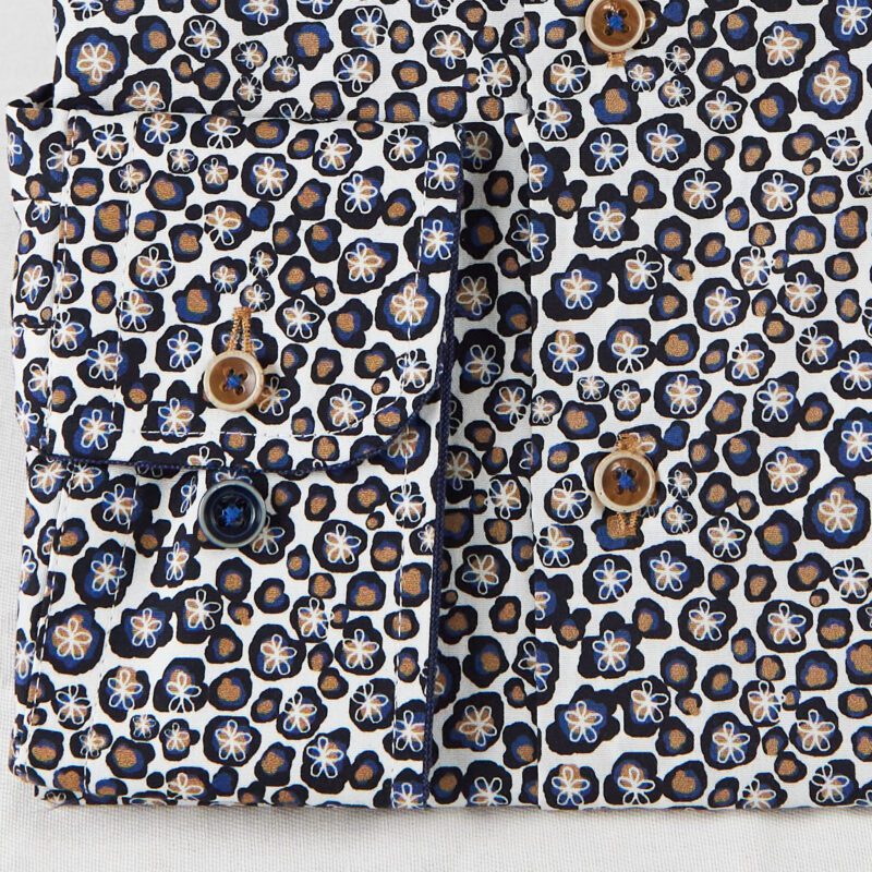 R2 white shirt with tiny blue and brown splodges with white flower outlines from Gabucci Bath