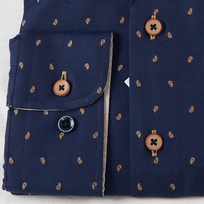R2 blue shirt with small brown sewn knot design from Gabucci Bath.