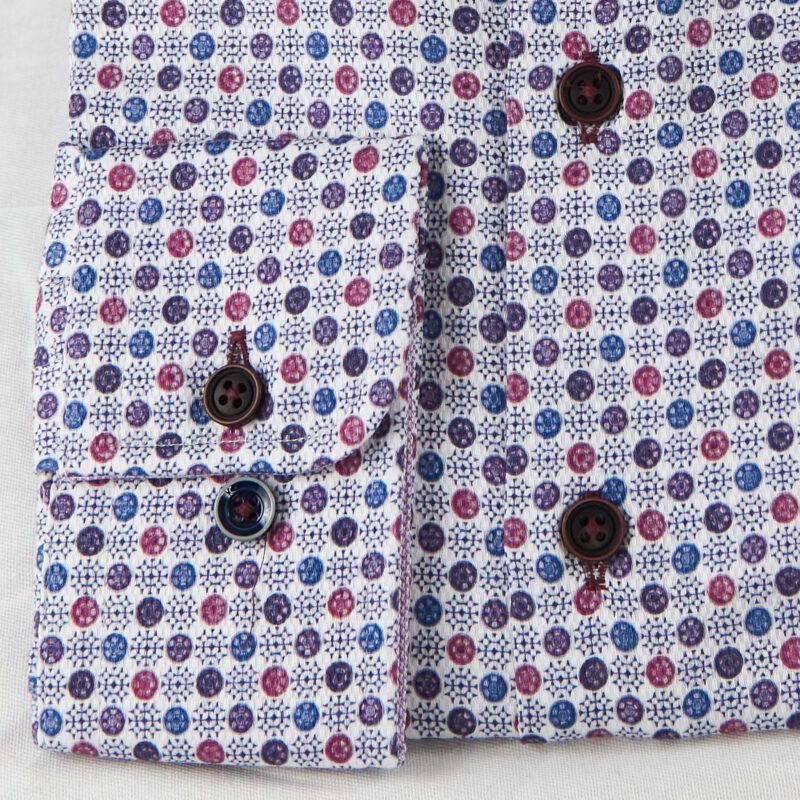 R2 white shirt with small red blue and purple circles and star design from Gabucci Bath.