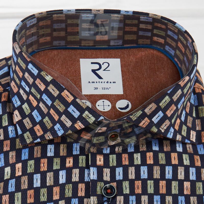 R2 black shirt with small blue green rust and brown rectangles from Gabucci Bath