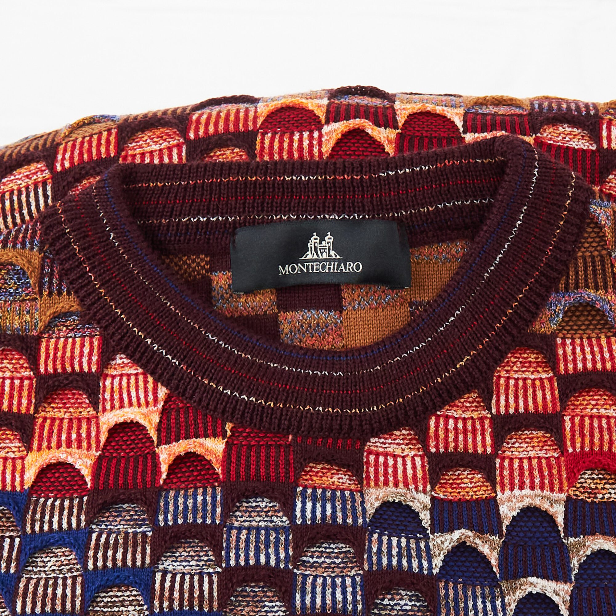 Montechiaro jumper with classic 3d design in red and blue, luxury Italian knitwear, beautifully designed and made. From Gabucci Bath.