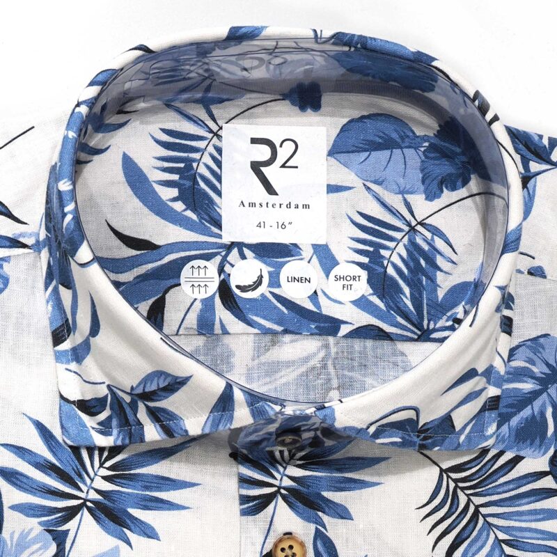 R2 white linen shirt with large blue flowers and foliage from Gabucci Bath.
