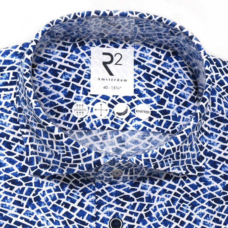 R2 shirt with small blue shapes on white from Gabucci Bath.