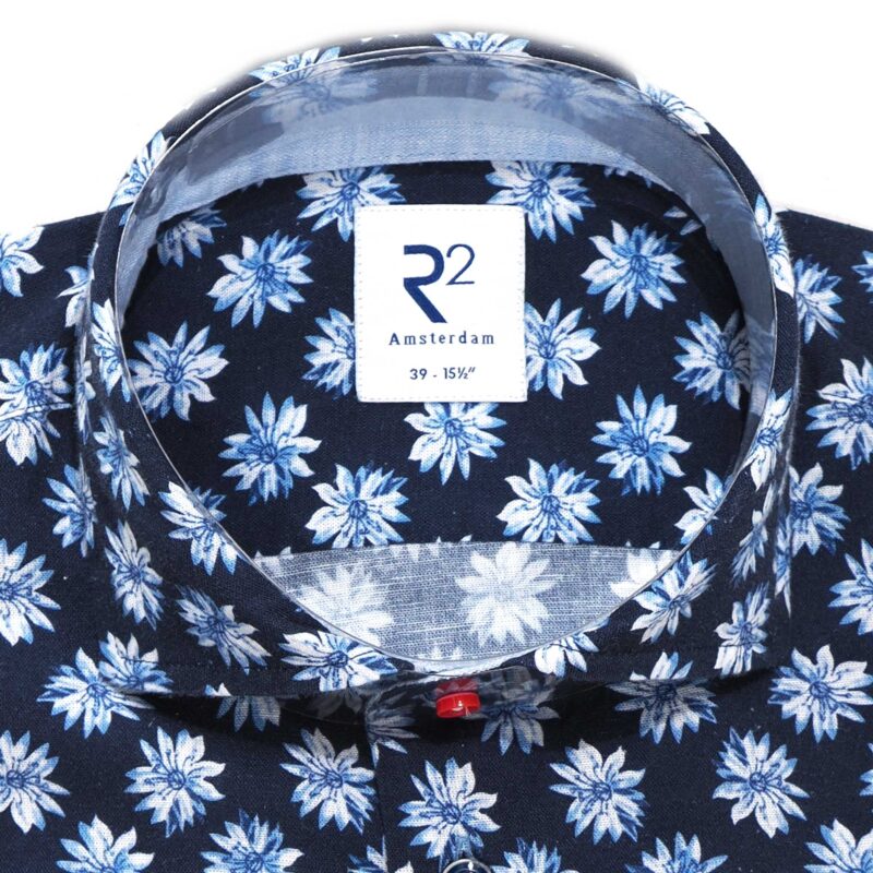 R2 shirt with small blue and white flowers on midnight blue from Gabucci Bath