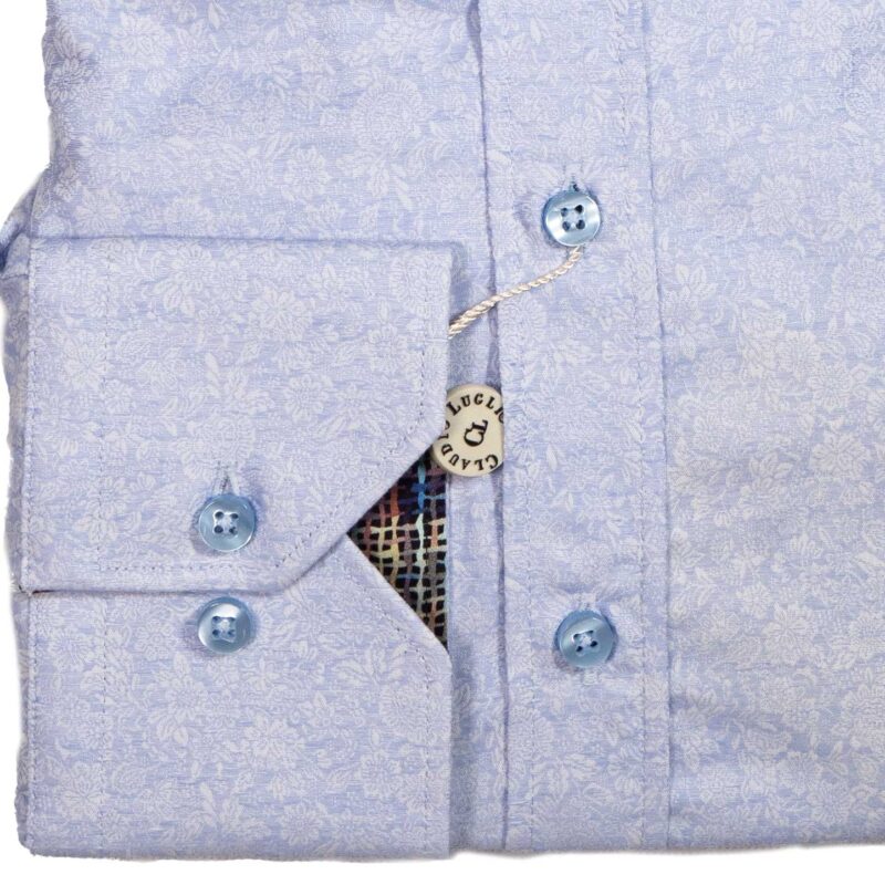 Claudio Lugli shirt in pale blue with white flowers and patterned lining from Gabucci Menswear in Bath