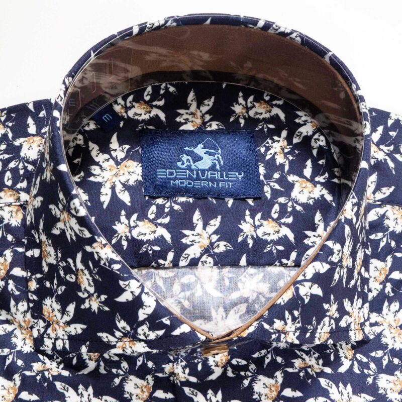 Eden Valley navy blue shirt with large white flower shapes with foliage underneath