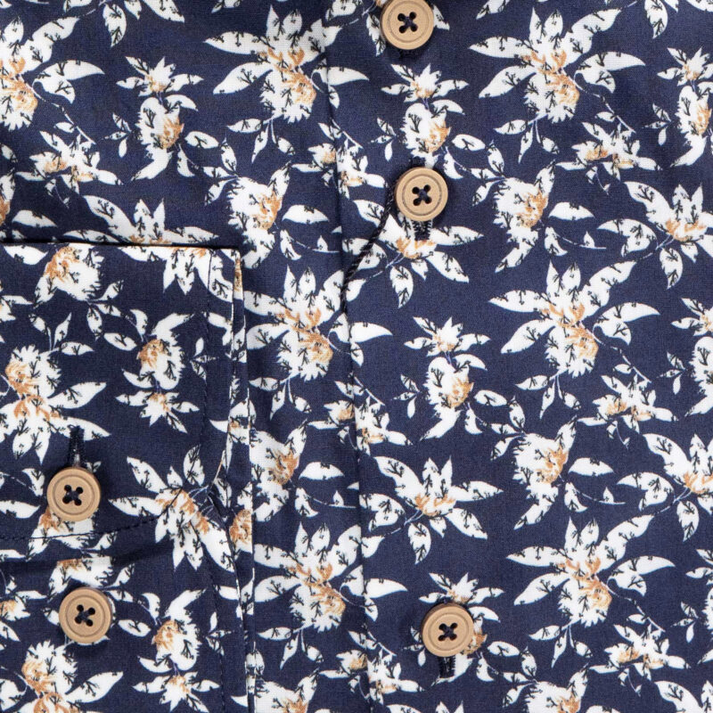 Eden Valley navy blue shirt with large white flower shapes with foliage underneath