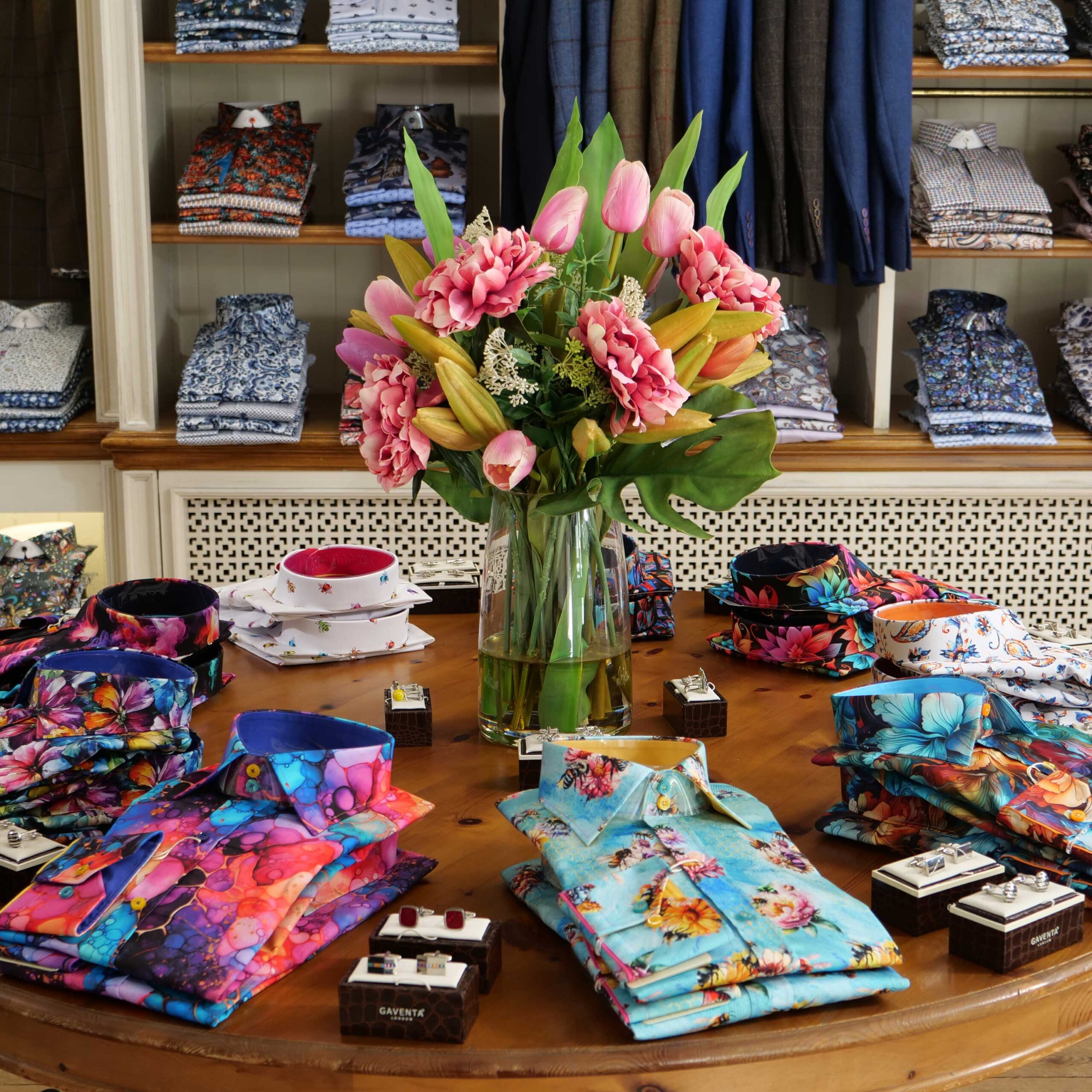 Display of shirts, suits and jumpers at Gabucci Menswear in Bath