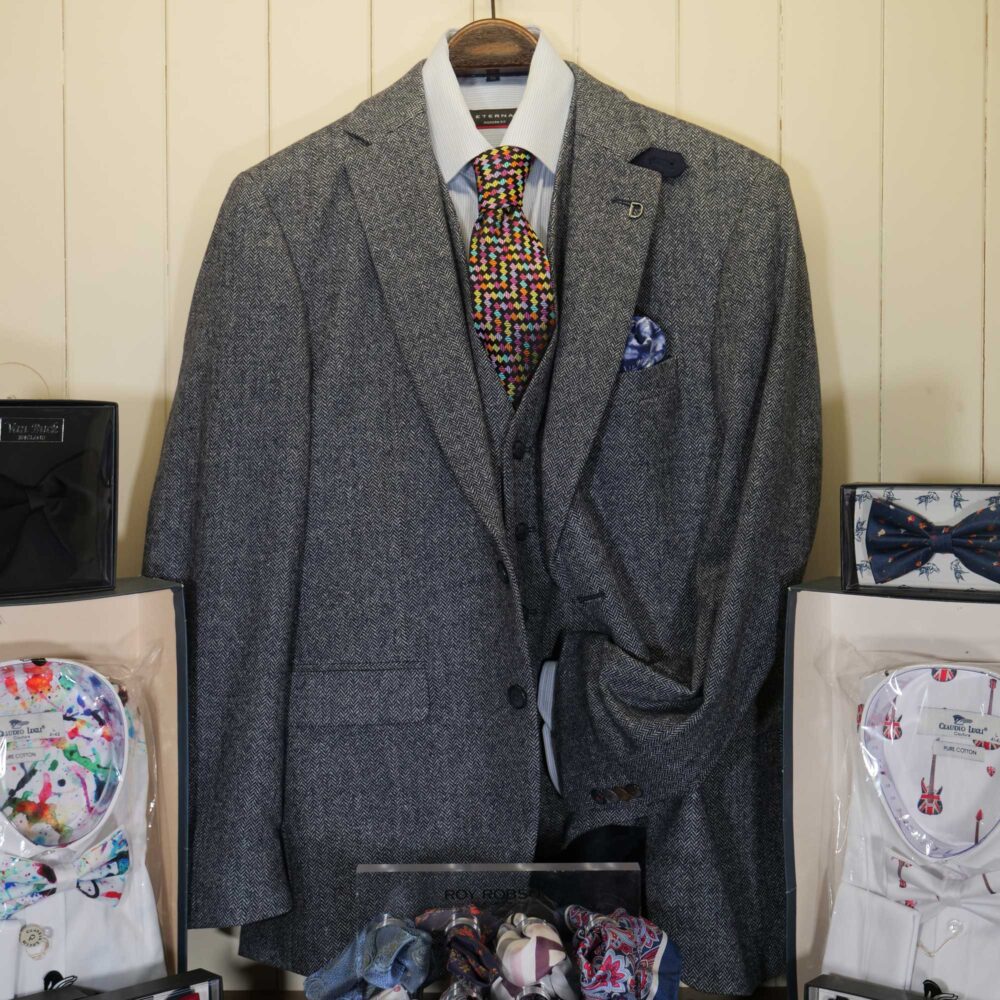 Display of shirts, suits and jumpers at Gabucci Menswear in Bath