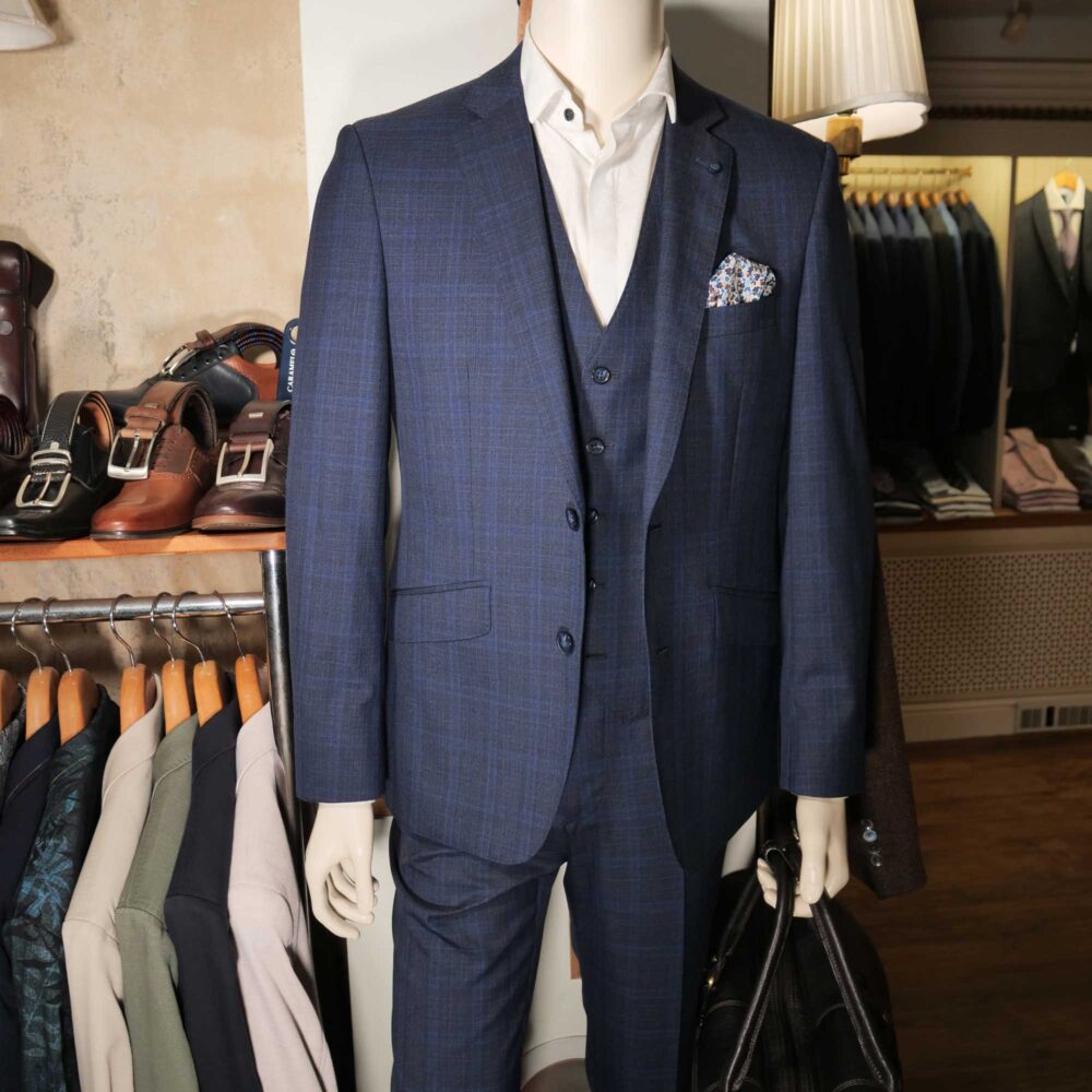 Display of shirts, suits and jumpers at Gabucci Menswear in Bath