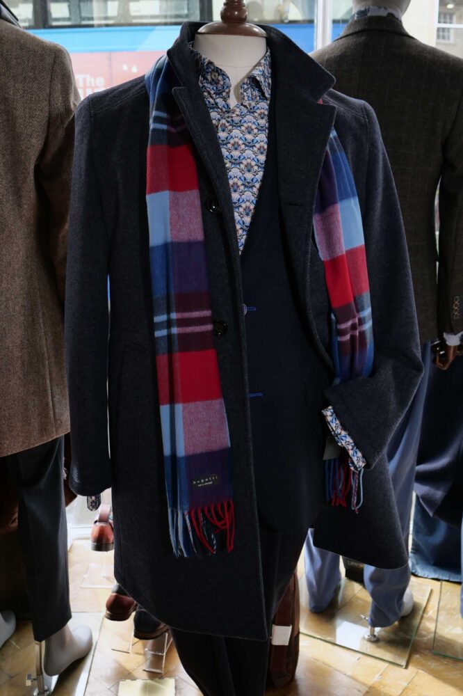 Display of shirts, suits and jumpers at Gabucci Menswear in Bath