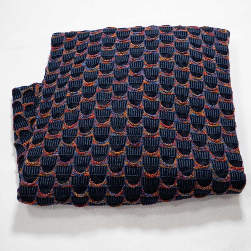 Lorenzoni jumper with classic 3d design in dark blue with red and yellow luxury Italian knitwear, beautifully designed and made. From Gabucci Bath.