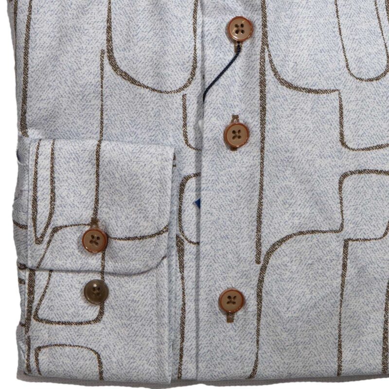 R2 blue shirt with brown lines creating powerful shapes reminiscent of stone cut figures