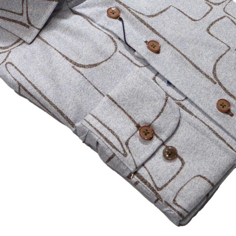 R2 blue shirt with brown lines creating powerful shapes reminiscent of stone cut figures