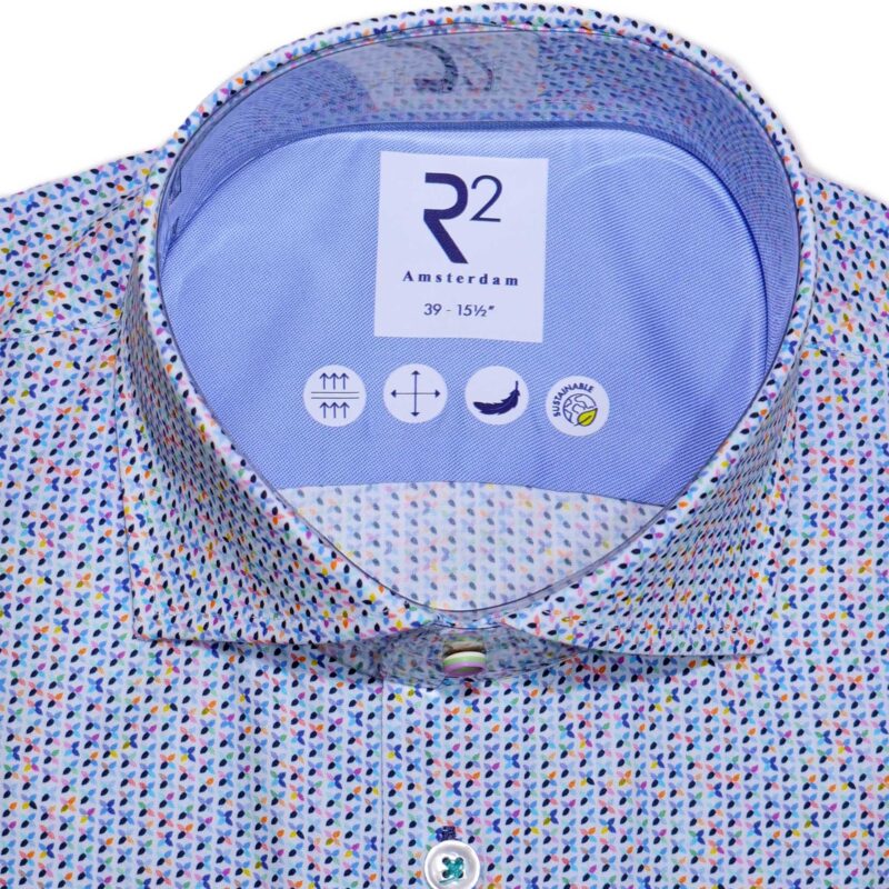 R2 blue shirt with tiny coloured flowers, and green stitching for the buttons