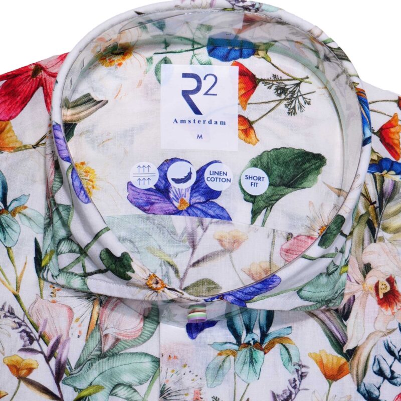R2 natural linen mix shirt with large illustrations of summer flowers on Texta Italian cloth. From Gabucci Menswear in Bath