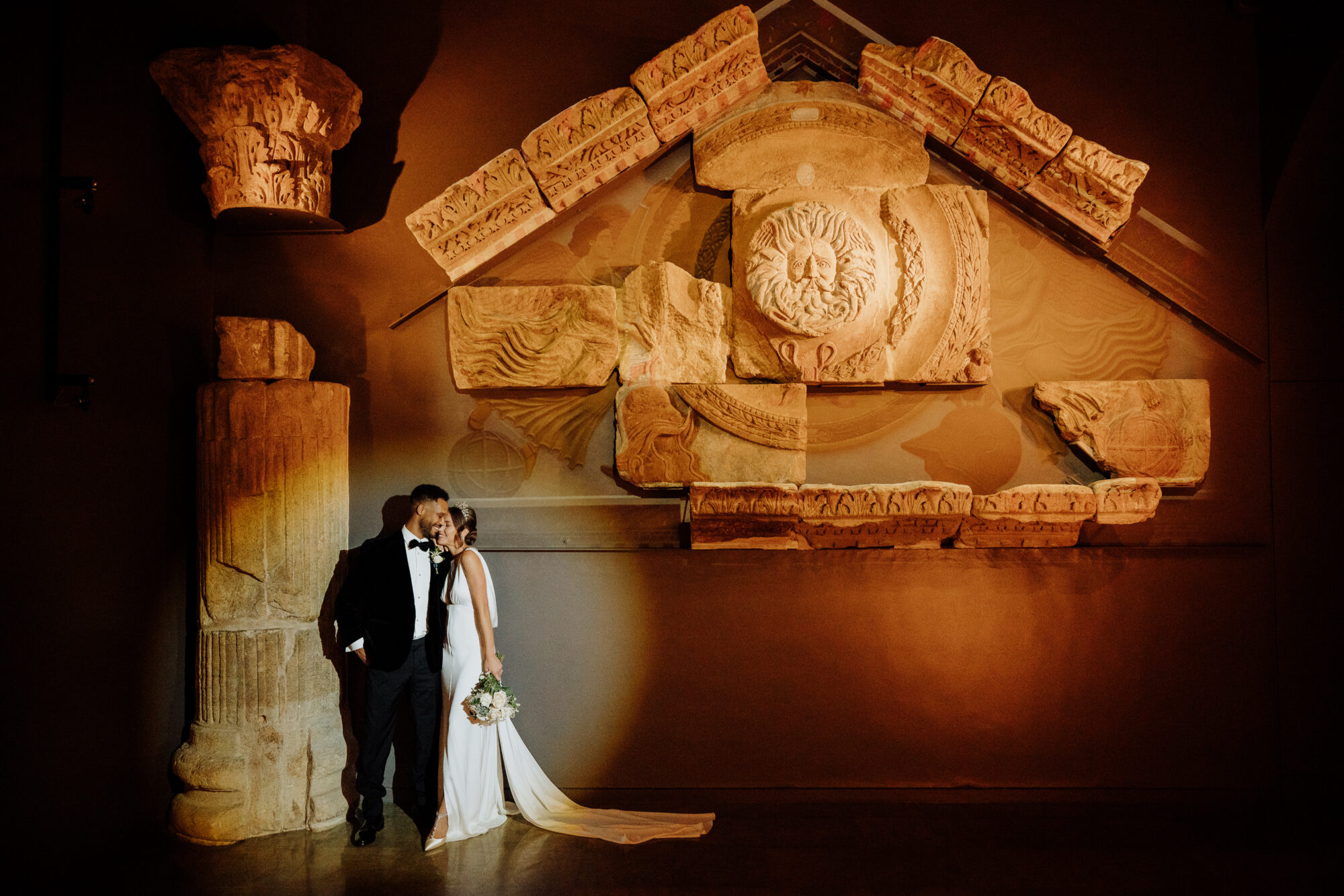 Image of wedding couple at the Royal Baths, Bath, the groom wears suit and shirt from Gabucci Menswear Bath, for Bath Royal Baths, shot by RICH HOWMAN & ELAN IMAGES LTD